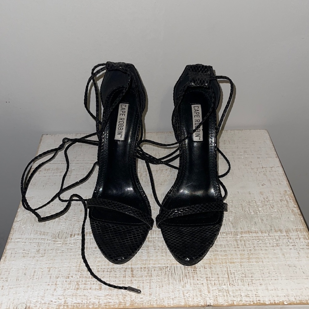 Cape Robbin black snake skin lace up heels.